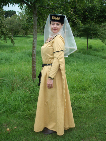 Yellow brocade dress with tippets