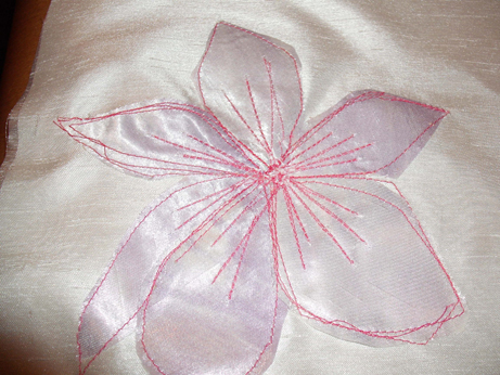 The appliqued flower with machined detail 
